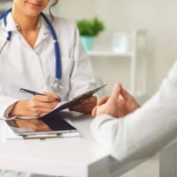A doctor speaks with their patient.