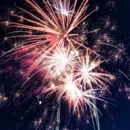 Close-up of fireworks in the night sky.